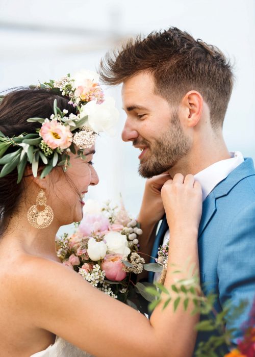 young-couple-in-a-wedding-ceremony-at-the-beach-MPTK5HL-scaled.jpg